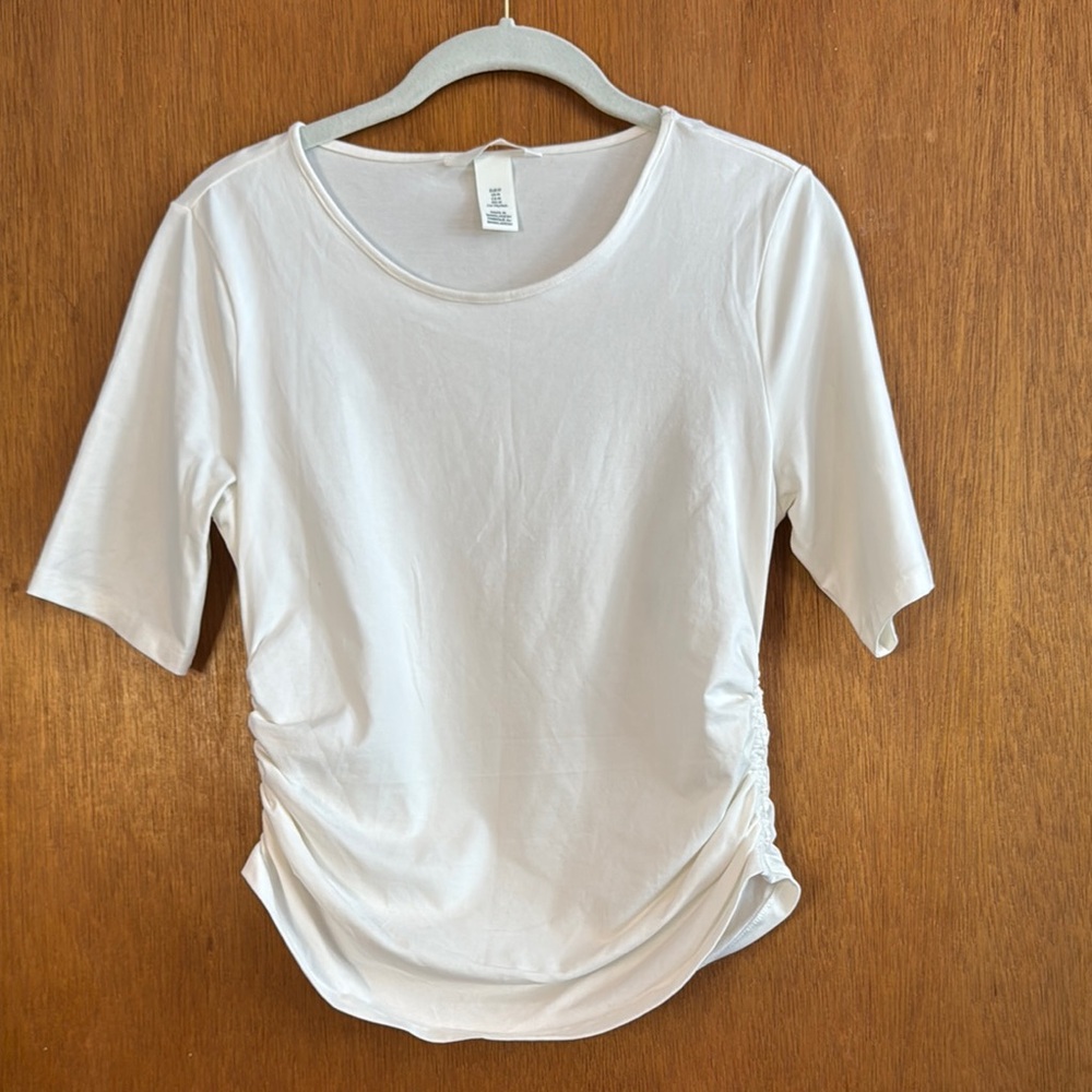 H&M White elbow length sleeve Tee gathered sides.